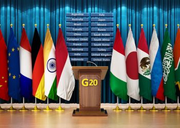 G20 country flags arranged in a conference room. 3D illustration.