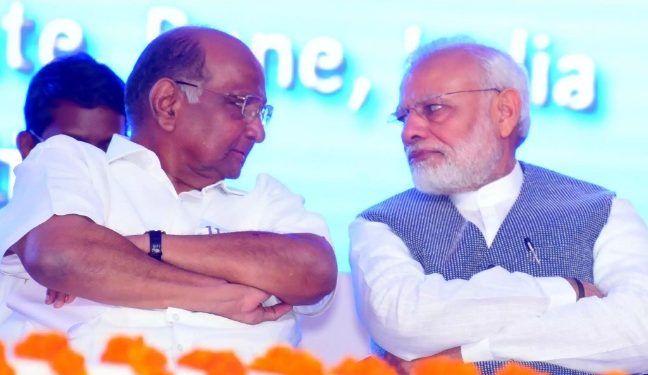 Sharad Pawar hands with PM Modi